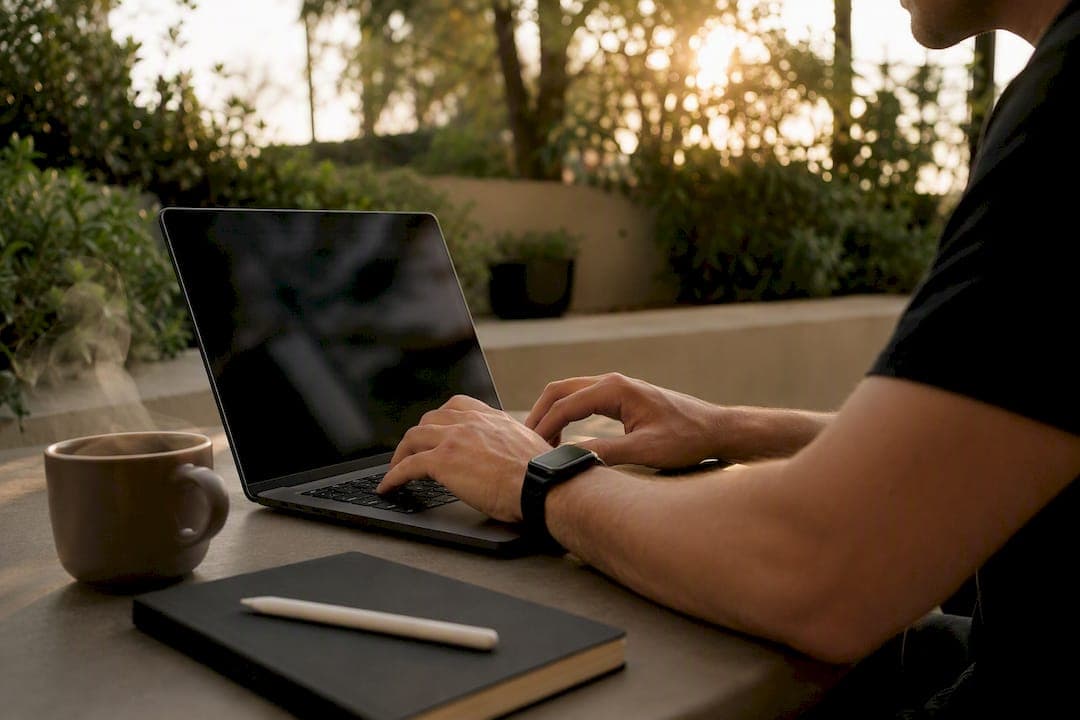 Hands typing to customize AI prompt on laptop