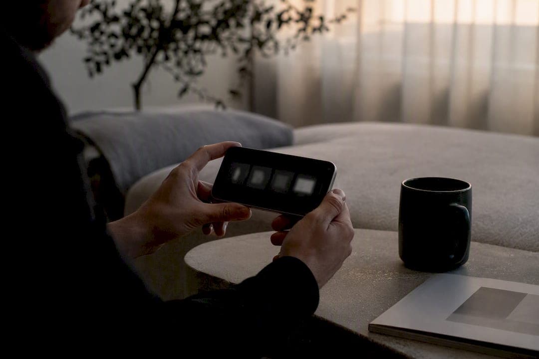 Hands holding smartphone checking carousel slides